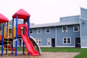 Playground with blue apartments