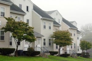 Townhouses with trees and fog