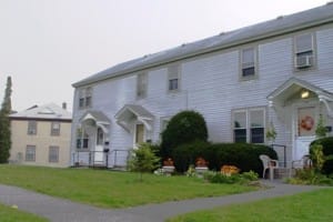Light blue townhouses with walkway
